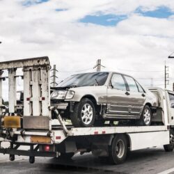 broken-car-tow-truck-after-traffic-accident-road-service_293060-485