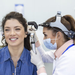 hearing-exam-otolaryngologist-doctor-checking-woman-s-ear-using-otoscope-auriscope-medical-clinic (1)