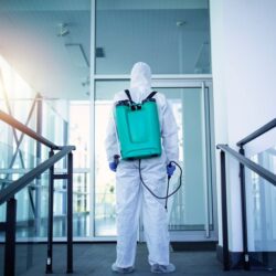 unrecognizable-person-white-protection-suit-disinfecting-public-areas-stop-spreading-highly-contagious-corona-virus_342744-918